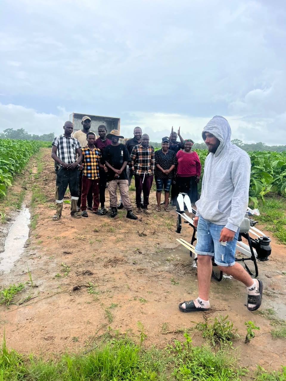 Participants standing beside the drone at the Beatrice event